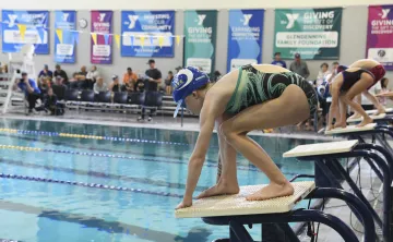 swimmer starting a race